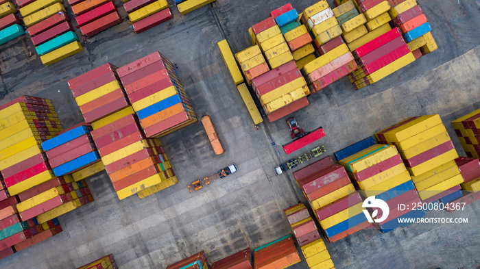 Aerial view reach stackers move containers at a freight terminal, Industrial container terminal and storage containers area.