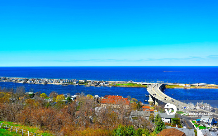 Road and Atlantic Ocean shore viewed from light house reflex