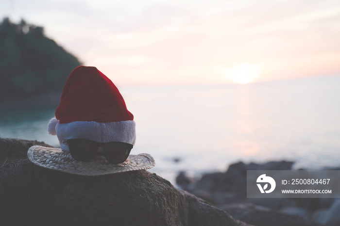 Christmas Santa hat on the beach. are texture Nature background creative tropical layout made at phuket Thailand