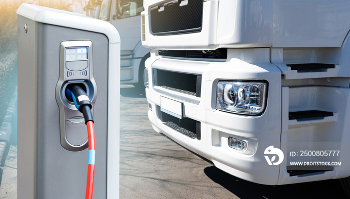 Electric vehicles charging station on a background of a truck. Concept