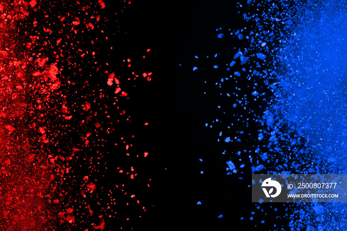 Blue and Red color powder explosion on black background. Colored cloud. Colorful dust explode. Paint Holi.