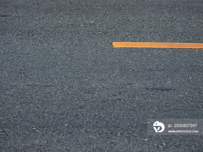 texture of asphalt road with yellow line