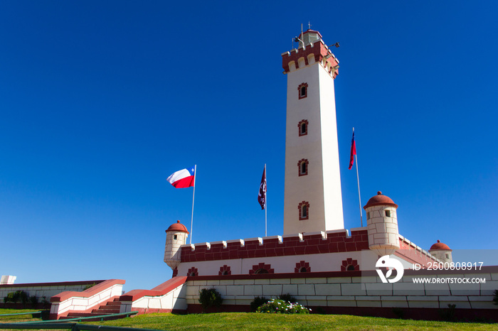 Splendid view of La Serena lighthouse on sunny day and Chilean flags blowing in the wind, Chile