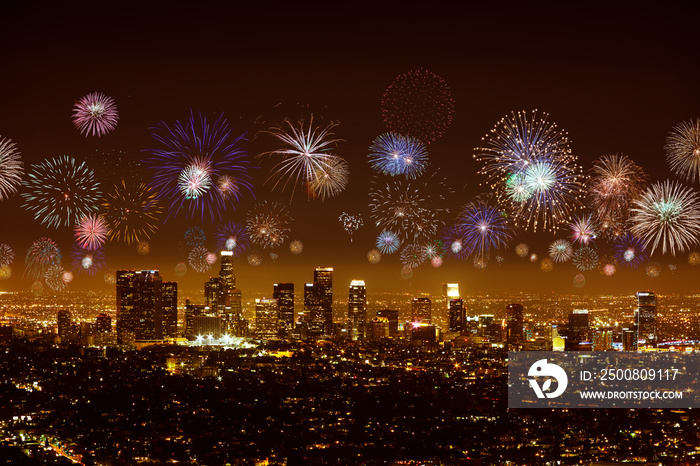 Downtown Los angeles cityscape with flashing fireworks celebrating New Year’s Eve.