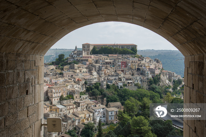 View to Ragusa Ibla in Sicily through arch