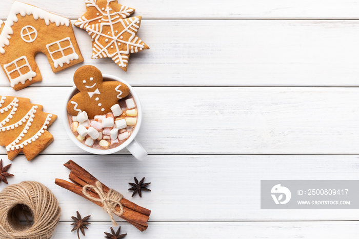 Gingerbread cookie man in cup of hot chocolate