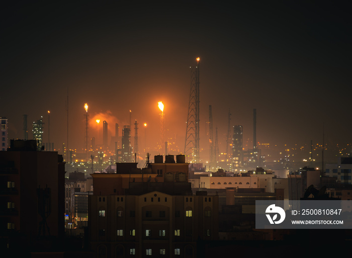 Night view of City with Oil Refinery in the background