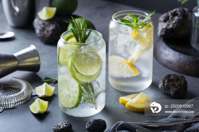 Hard seltzer cocktails with lime and lemon and bartenders accessories