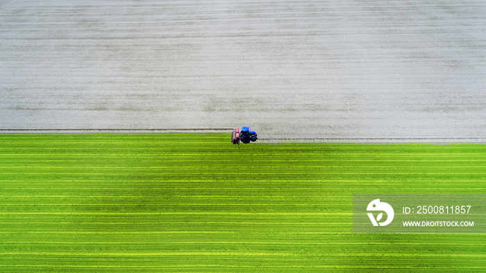 Aerial view of a tractor plowing a field