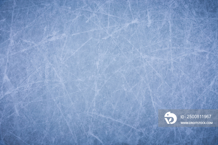 Ice background with marks from skating and hockey, blue texture of rink surface with many scratches