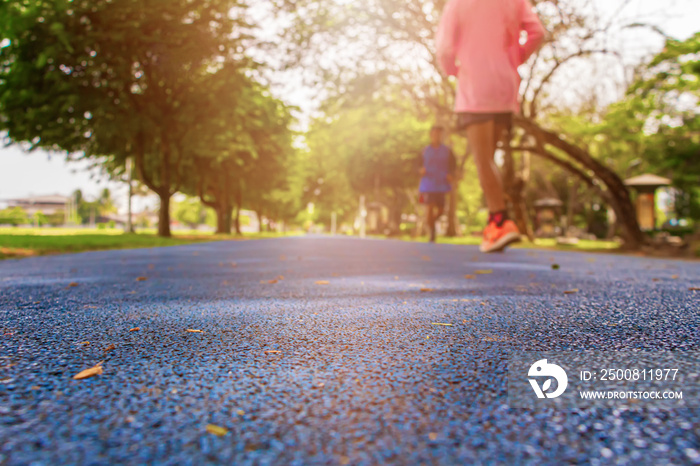 track run rubber cover blue in public park jogging exercise for health and blur people runner. select focus with shallow depth of field