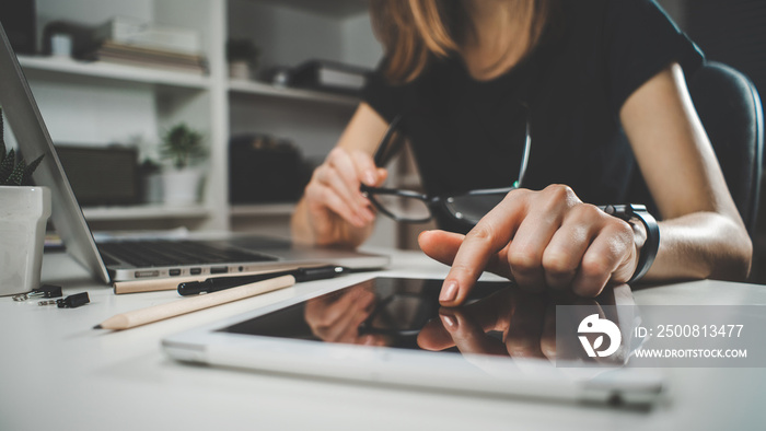 Female freelancer working at home using her laptop