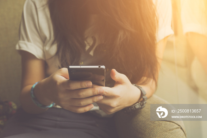 Young woman sitting using smartphone in coffee cafe, urban women lifestyle