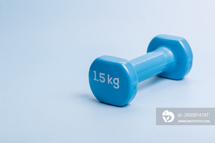 A pair of blue dumbbells on a blue background