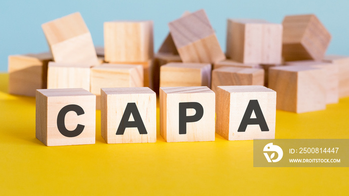 capa word construction with letter blocks and a shallow depth of field