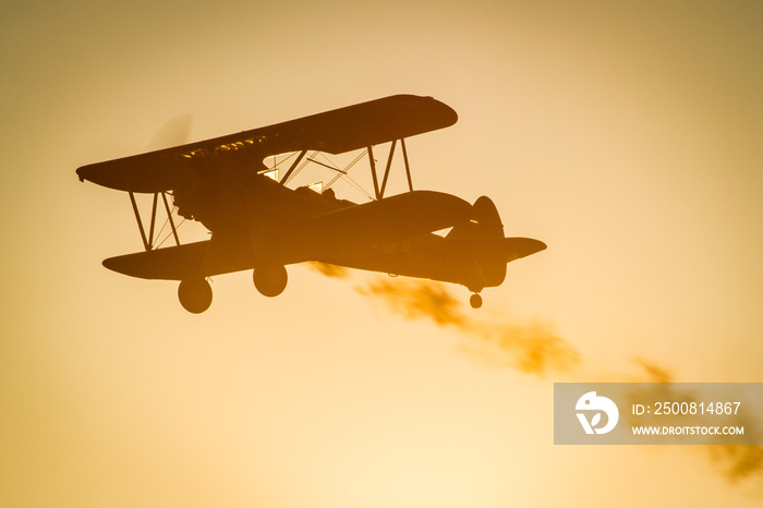 Boeing Stearman biplane during sunset in the air