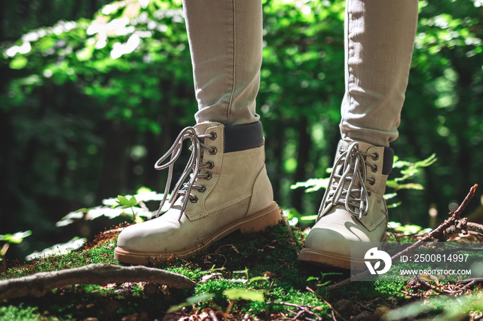 Hiker standing in forest. Hiking boot