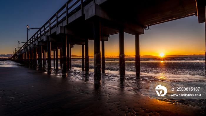 Sun Setting over Canada’s Longest Pier in Semiahmoo Bay at the village of White Rock in British Columbia, Canada