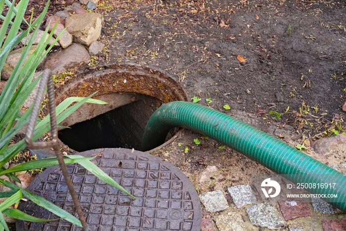 pumping septic tanks from the backyard tank in the countryside