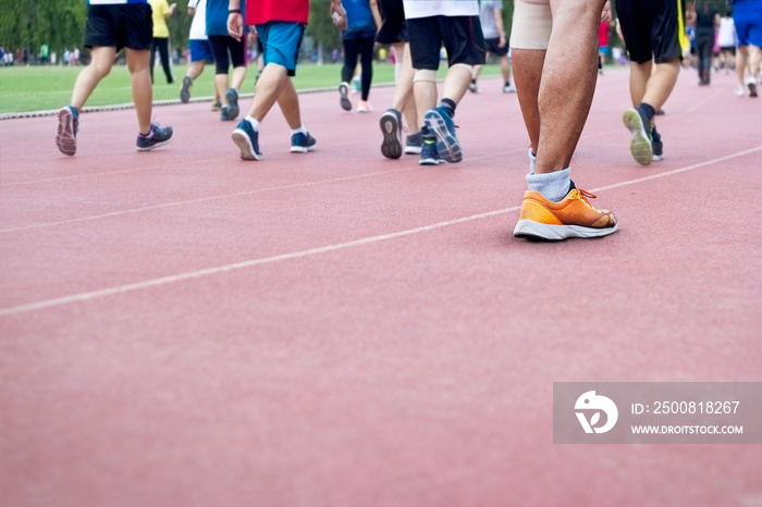 a lot of people excercising walk on runing track background, blank text