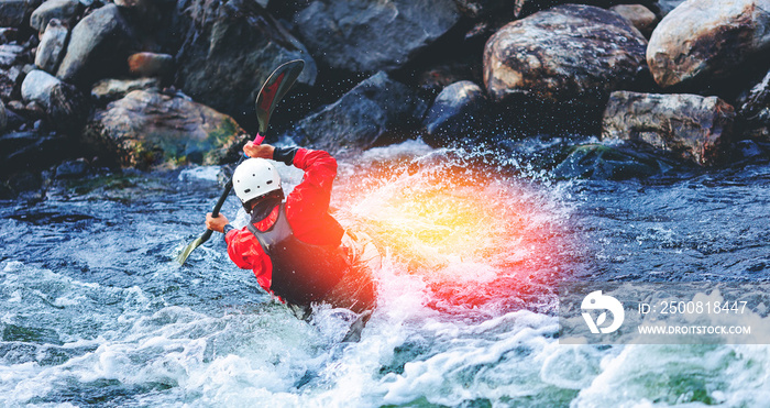 Extreme water sports, rafting on mountain river in kayak. Kayaker man strives for victory, boating championship