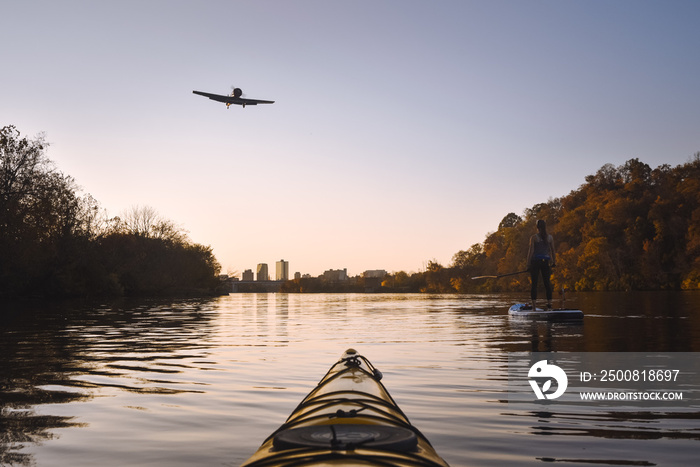 Passing the airport while paddling on the Tennessee River in Knoxville at Sunset