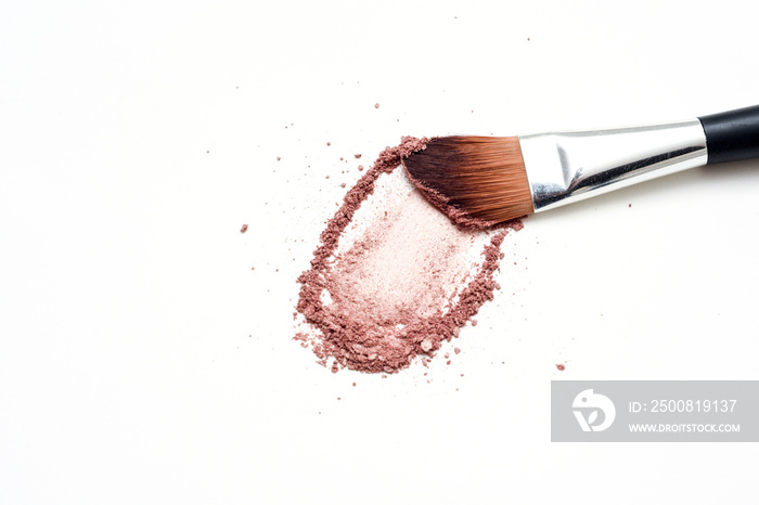 Make up brush with brush stroke of colored make up powder