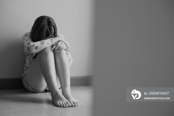 Female sitting alone at home with feeling unhappy and confused problem in personal life,Unexpected pregnancy concept,Black and white toned