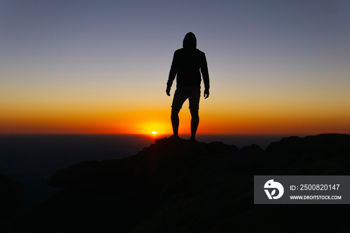 Epic Silhouette Of Man On Mountain Peak At Sunrise Success Concept