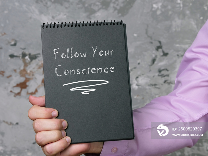 Lifestyle concept about Follow Your Conscience with phrase on the page.