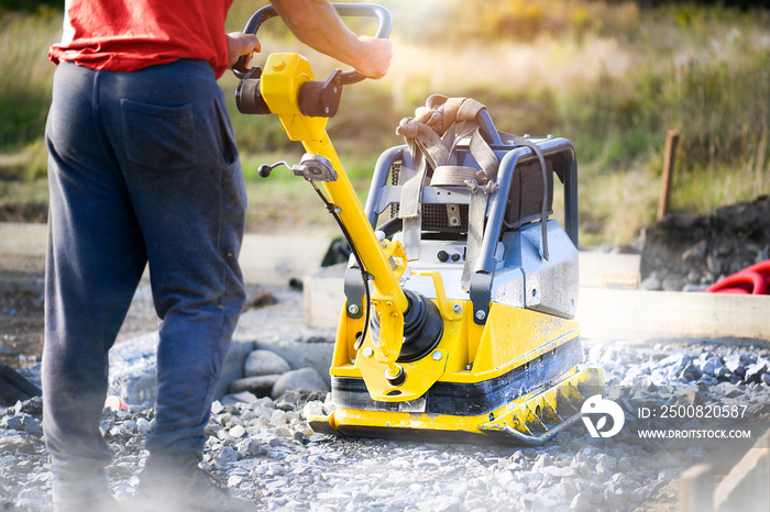 Vibration plate heavy machine compactor for construction compacting or beating sand.