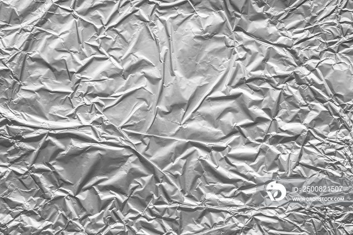 Shiny metal silver gray foil crumpled texture background