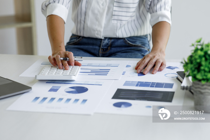 Financial Businesswomen analyze the graph of the company’s performance to create profits and growth,Market research reports and income statistics,double exposure with Financial Accounting concept.