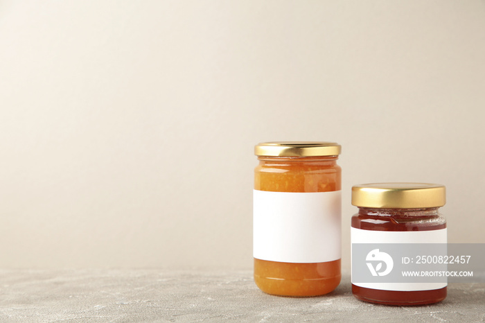 Assortment of jam jars mock-up. Jars with blank label on grey