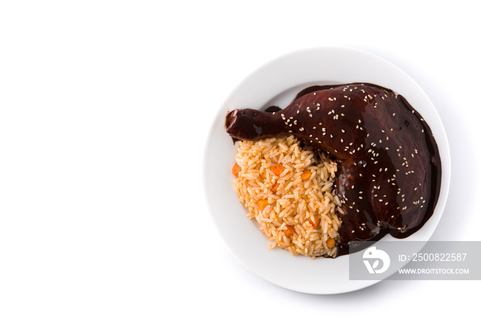 Traditional mole Poblano with rice in plate isolated on white background. Top view. Copy space