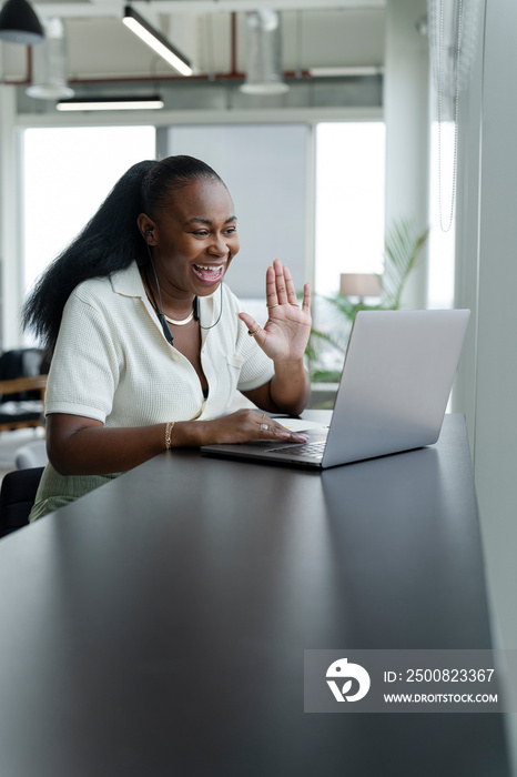 Businesswoman with laptop working in modern office