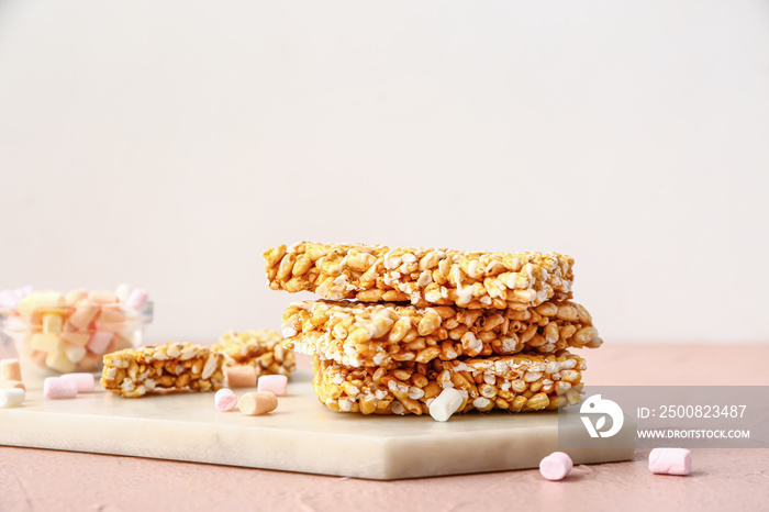 Board with crispy rice bars on table