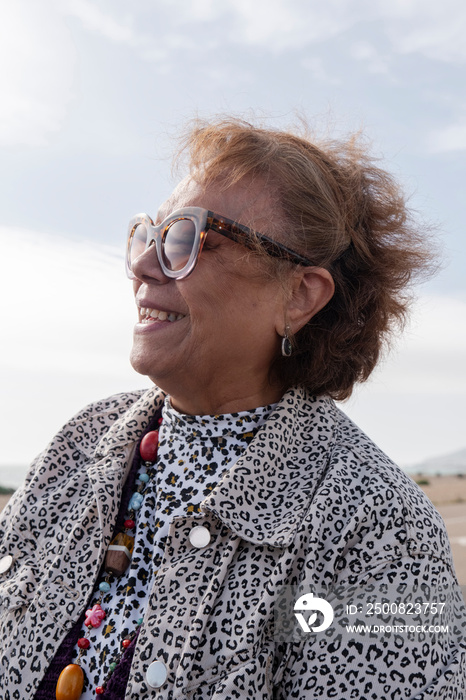 Portrait of senior woman in sunglasses on sunny day