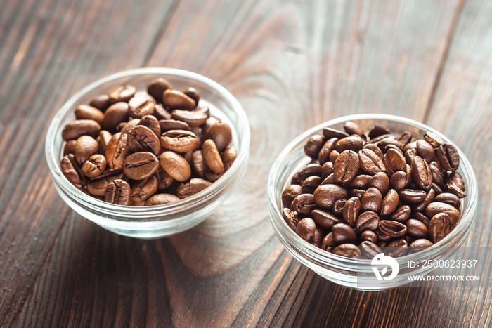 Bowls of arabica and robusta coffee beans