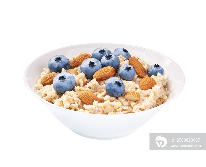 Homemade  oatmeal porridge with blueberries and almond  in ceramic bowl isolated.   Healthy eating, healthy breakfast food.