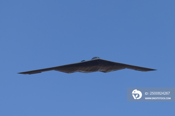 Unusual frontal view of a B-2 Spirit  stealth bomber in beautiful light