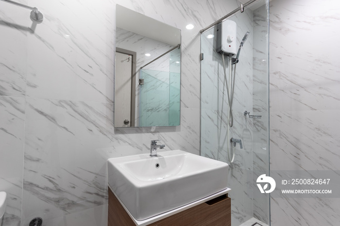 White Modern and Wood Bathroom with Shower Cabin Glass and Big mirror in Apartment..