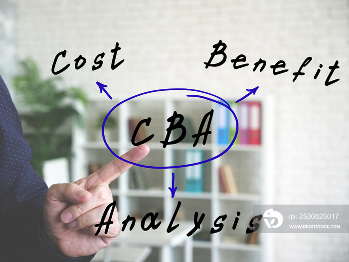 CBA Cost Benefit Analysis on Concept photo. Businessman hand point finger on an background.