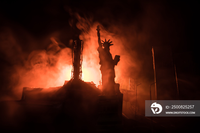 Empty street of burnt up city, flames on the ground and blasts with smoke in the distance. Apocalyptic view of city downtown as disaster film poster concept. Night scene. City destroyed by war.