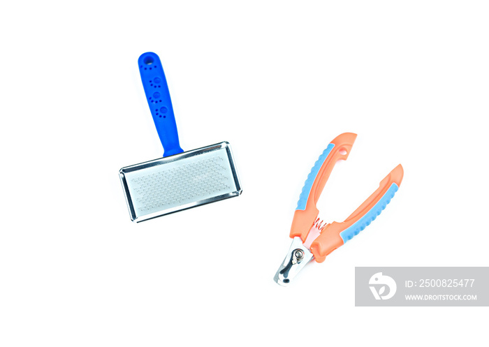 Pet supplies concept.  Pet brush and Nails scissors isolated on white background.