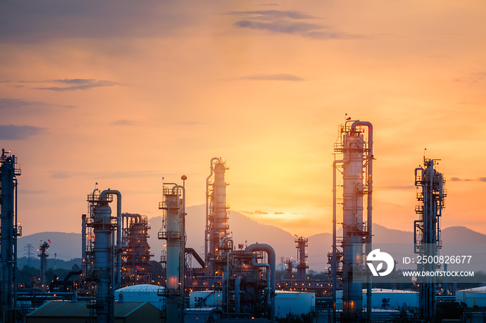 Gas refinery plant on sunset sky background, Manufacturing of petrochemical industrial plant with distillation tower and pipeline on sunrise sky background