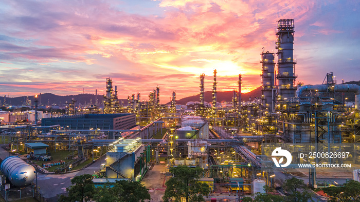 Aerial view Oil refinery.Industrial view at oil refinery plant form industry zone with sunrise and cloudy sky.Oil refinery and Petrochemical plant at dusk Thailand. Oil refinery background.