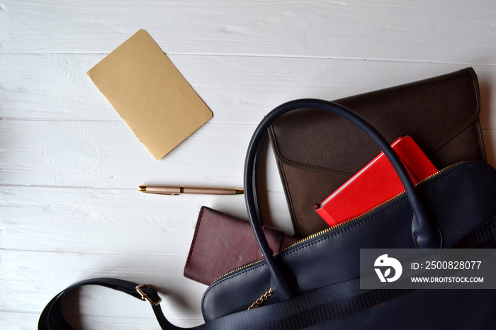 Business bag and empty paper on the desk. Business flat lay.