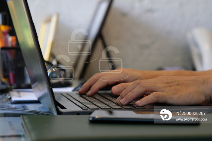 Person working on laptop computer and user typing login and password, cyber security concept, data protection and secured internet access, cybersecurity