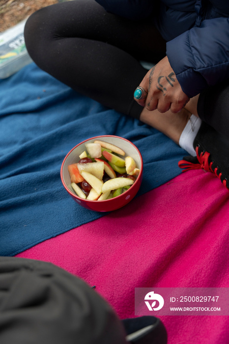 Woman eating fruit in tent